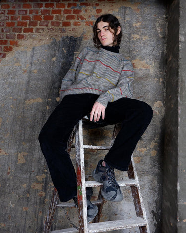 Embrace this colorful striped sweater. Perfect for a comfy, laid-back look!