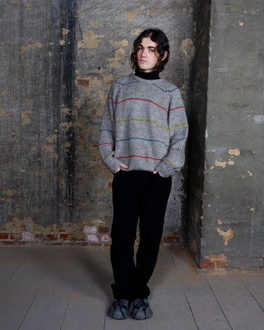 Embrace this colorful striped sweater. Perfect for a comfy, laid-back look!