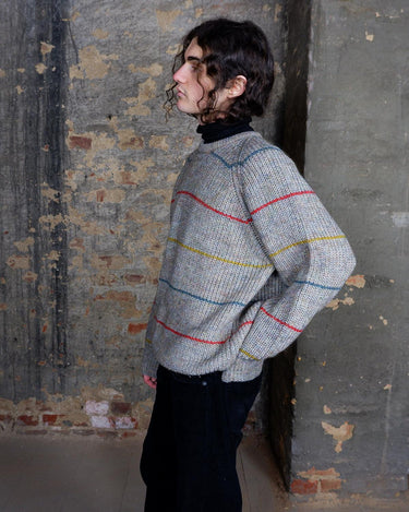 Embrace this colorful striped sweater. Perfect for a comfy, laid-back look!