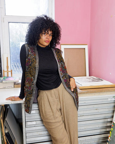 Shimmer your way with this vintage ultra-thin vintage 80s 90s vest, featuring a colorful floral design. 