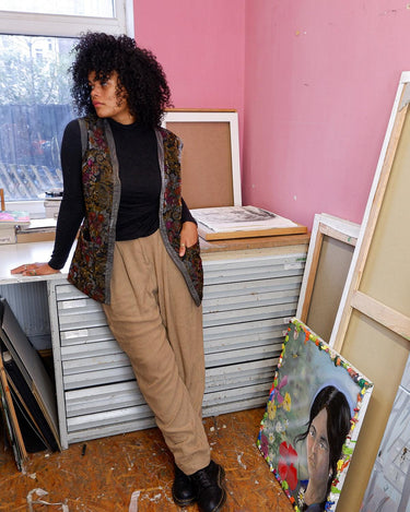 Shimmer your way with this vintage ultra-thin vintage 80s 90s vest, featuring a colorful floral design. 