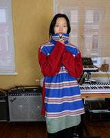 Get cozy in this vintage 90s red and blue striped half zip sweater. Perfect for those chilly days, this sweater is both stylish and comfortable. With its unique half zip design, you can easily adjust the neckline for the perfect fit.