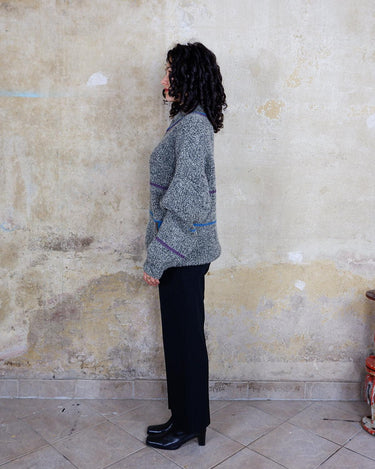 Get cozy with our Vintage 80s grey zip cardigan featuring colorful stripes. Perfect for a casual look. Zip it up