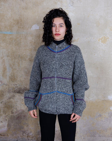 Get cozy with our Vintage 80s grey zip cardigan featuring colorful stripes. Perfect for a casual look. Zip it up