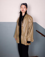 Level up your fashion game with this vintage 80s leather jacket! It features iconic shoulder pads for an edgy, bold look.