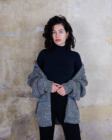 Get cozy with our Vintage 80s grey zip cardigan featuring colorful stripes. Perfect for a casual look. Zip it up