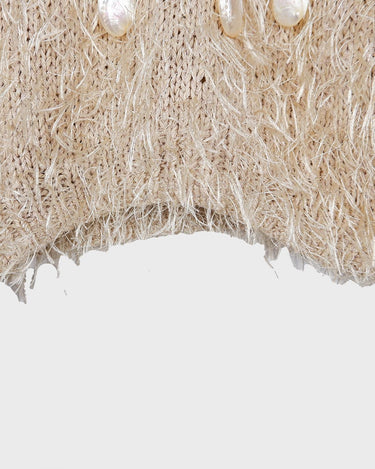 Cuddle up in this 90s vintage sweater, featuring a furry beige and dirty white design. The unique 1/2 sleeve style and attached shell add an extra touch of playful charm. We absolutely love this unique sweater! What about you? 