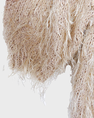 Cuddle up in this 90s vintage sweater, featuring a furry beige and dirty white design. The unique 1/2 sleeve style and attached shell add an extra touch of playful charm. We absolutely love this unique sweater! What about you? 
