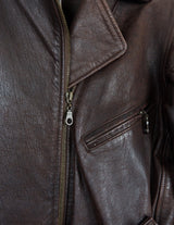 Look sharp in this vintage 80s chocolate brown belted biker leather jacket! Be the baddest biker on the block with this classic piece. Perfect for adding some edge to your look with a bit of attitude. Get ready to hit the highway!