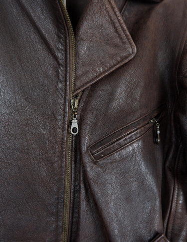 Look sharp in this vintage 80s chocolate brown belted biker leather jacket! Be the baddest biker on the block with this classic piece. Perfect for adding some edge to your look with a bit of attitude. Get ready to hit the highway!