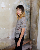 Preloved and handmade, this silver crochet top catches the light with its soft shimmer. The open-knit design and asymmetrical cut give it that effortless, worn-in feel. A rare find that’s easy to style and full of character.