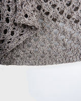 Preloved and handmade, this silver crochet top catches the light with its soft shimmer. The open-knit design and asymmetrical cut give it that effortless, worn-in feel. A rare find that’s easy to style and full of character.