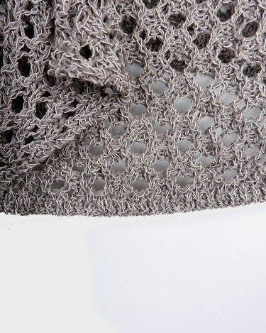 Preloved and handmade, this silver crochet top catches the light with its soft shimmer. The open-knit design and asymmetrical cut give it that effortless, worn-in feel. A rare find that’s easy to style and full of character.