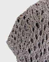 Preloved and handmade, this silver crochet top catches the light with its soft shimmer. The open-knit design and asymmetrical cut give it that effortless, worn-in feel. A rare find that’s easy to style and full of character.