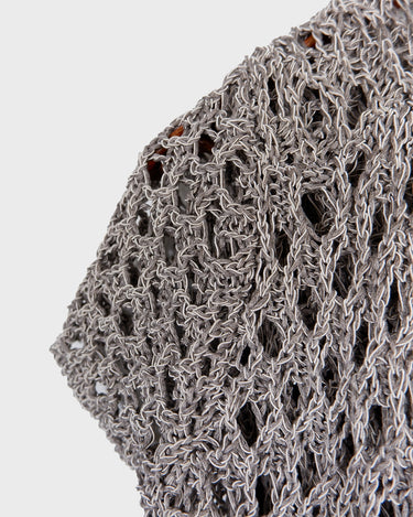 Preloved and handmade, this silver crochet top catches the light with its soft shimmer. The open-knit design and asymmetrical cut give it that effortless, worn-in feel. A rare find that’s easy to style and full of character.