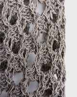 Preloved and handmade, this silver crochet top catches the light with its soft shimmer. The open-knit design and asymmetrical cut give it that effortless, worn-in feel. A rare find that’s easy to style and full of character.
