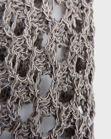Preloved and handmade, this silver crochet top catches the light with its soft shimmer. The open-knit design and asymmetrical cut give it that effortless, worn-in feel. A rare find that’s easy to style and full of character.