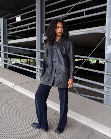 Vintage 80s black fireman clasp leather coat with light shoulder pads | L-XL