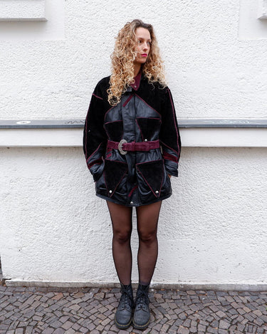 Experience the edgy and unique style of the 80s with our Vintage Black/Burgundy Patchwork Biker Leather Jacket. Crafted from high-quality leather, this jacket features a bold color combination of black and burgundy.