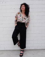 Look your wildest in our Crazy pattern short sleeve light shimmering blouse! This tailored fit gives you a sleek silhouette that shimmers in the light! Featuring a unique pattern, you'll be making an elegant statement everywhere you go! Shimmy on!