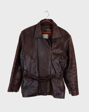 Look sharp in this vintage 80s chocolate brown belted biker leather jacket! Be the baddest biker on the block with this classic piece. Perfect for adding some edge to your look with a bit of attitude. Get ready to hit the highway!