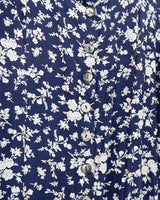 Dress to impress in this vintage 90s blue midi dress with a floral pattern! Tie it tighter for an S-M fit or let it go for a L-XL! Get yours now and get dressed to express!