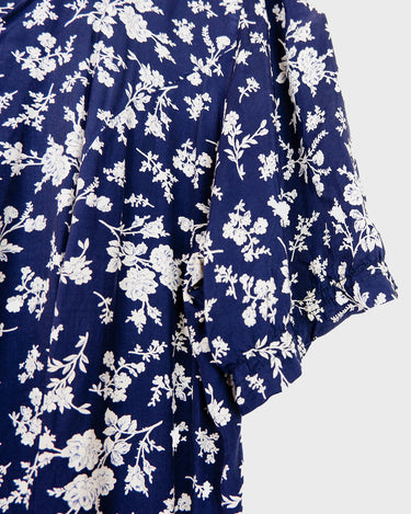 Dress to impress in this vintage 90s blue midi dress with a floral pattern! Tie it tighter for an S-M fit or let it go for a L-XL! Get yours now and get dressed to express!