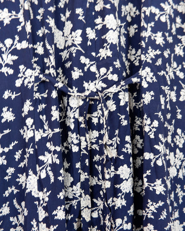 Dress to impress in this vintage 90s blue midi dress with a floral pattern! Tie it tighter for an S-M fit or let it go for a L-XL! Get yours now and get dressed to express!