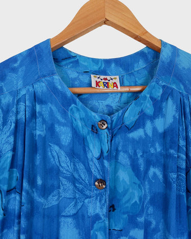 Make every summer night magical in this Vintage 80s blue light transparent viscose dress! It features delicate floral pattern detail, and is ultra lightweight – so you can float through the night with ease! 