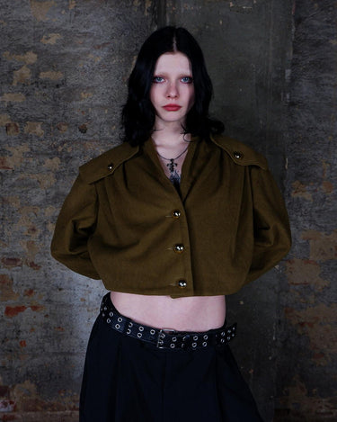 Add a touch of luxury to your wardrobe with this timeless Vintage 90s green/khaki cashmere mix jacket! With its unique blend of cashmere and shoulder pads for added structure, this jacket will elevate any outfi!