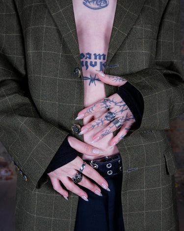 Get ready to make a statement with this Vintage 80s green checkered pattern blazer! Featuring shoulder pads for a bold silhouette, this blazer exudes casual vibes with a playful twist.