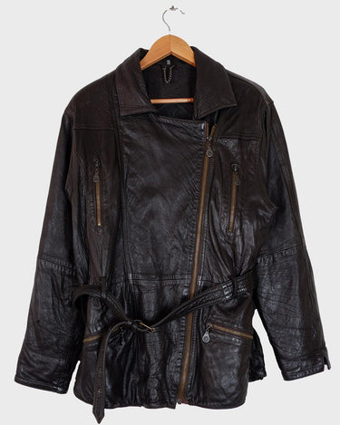 Experience the rustic charm of this vintage 80s chocolate brown leather biker jacket! The buttery-soft leather is sure to make you feel like you’re in the driver’s seat of life. Complete with a belt closure, this jacket is an ideal choice for a stylish and timeless look. Rev up your wardrobe today!