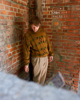 This vintage sweater has fall vibes written all over it, thanks to its alpaca and lambs wool mix in a cozy brown, mustard-yellow combo! 