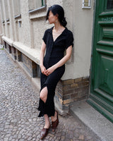 Capture the sleek vibes of the 90s in this black ripped elastic dress! The ripped and elastic material will hug your body in all the right places. You can even customize your look with the option to tie it up at the back. Wear this 90s dream with confidence! Let's gooo!