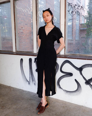 Capture the sleek vibes of the 90s in this black ripped elastic dress! The ripped and elastic material will hug your body in all the right places. You can even customize your look with the option to tie it up at the back. Wear this 90s dream with confidence! Let's gooo!