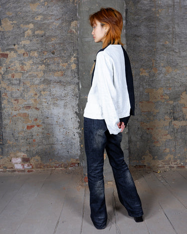 Rockin' 80s vibes with this black and white color blocking linen blouse! Perfect for any vintage lover, this blouse offers a playful twist on a classic look. Add it to your collection for a unique look.