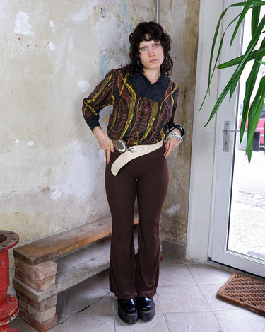 This vintage 80s sweater is a real trip! Featuring a wild yellow and orange psychadelic pattern, it will upgrade every basic outfit. This sweater is perfect for spring!