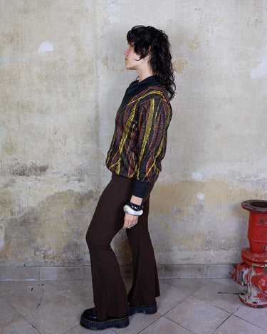 This vintage 80s sweater is a real trip! Featuring a wild yellow and orange psychadelic pattern, it will upgrade every basic outfit. This sweater is perfect for spring!