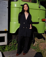   Revive 90s vintage flair with this black short sleeve summer blazer! Clothe yourself in minimalism design, featuring a long cut and super light fabric.
