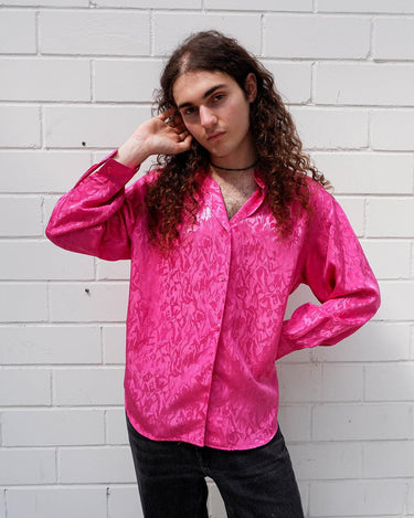 This pink blouse will have you feelin' those '80s vibes! Enjoy all that extra sparkle with this glitzy long sleeve look!