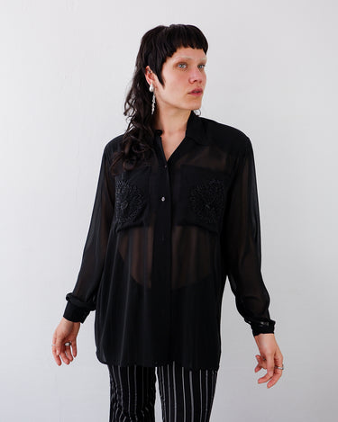 Vintage 80s 90s black mesh long sleeve blouse with embroidered front pockets and shoulder pads | S-XL