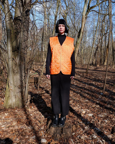 Add a pop of color to your wardrobe with this Vintage 90s orange spring vest! Lightweight and perfect for layering,