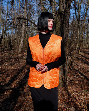 Add a pop of color to your wardrobe with this Vintage 90s orange spring vest! Lightweight and perfect for layering,