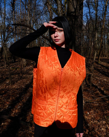 Add a pop of color to your wardrobe with this Vintage 90s orange spring vest! Lightweight and perfect for layering,