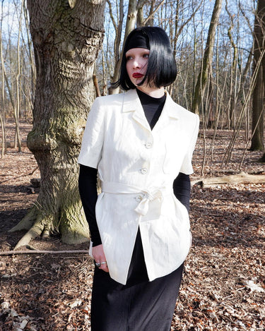 Slip into effortless luxury with this vintage Max Mara pure linen blouse — straight from the golden age of 90s Italian fashion. With its sharp lapels, sculpted silhouette, and waist-defining belt, it’s pure understated power dressing. Made from 100% premium linen, it’s light, luxe, and built for those sun-drenched days. Vintage Max Mara never goes out of style.