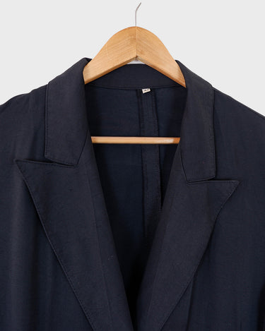  Revive 90s vintage flair with this black short sleeve summer blazer! Clothe yourself in minimalism design, featuring a long cut and super light fabric.