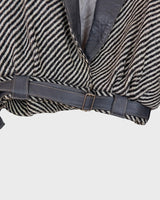 Own a piece of classic 80s style with this eye-catching vintage grey striped jacket! Crafted from a vegan leather and wool mix, it's got a deep cut and a belt to give it that extra special something. (Note: Definitely one of my favourite jackets so far)