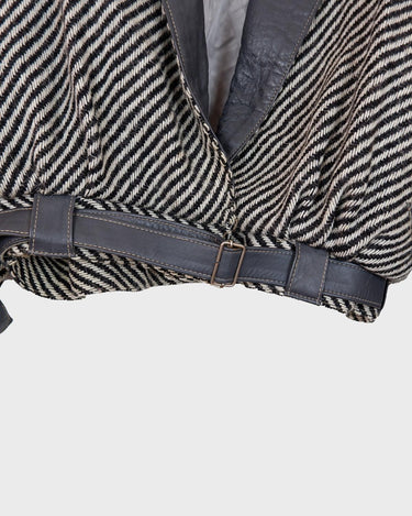 Own a piece of classic 80s style with this eye-catching vintage grey striped jacket! Crafted from a vegan leather and wool mix, it's got a deep cut and a belt to give it that extra special something. (Note: Definitely one of my favourite jackets so far)
