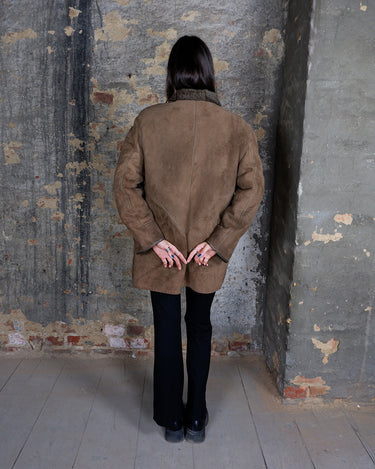 Vintage 80s brown shearling coat with asymmetric closure and shoulder pads | M-L