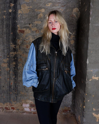 This Vintage 80s denim lamb leather patchwork bomber jacket AND vest is the perfect balance of oldschool and casual charm. Made with high quality materials, it's a statement piece that will add a touch of vintage to any outfit.